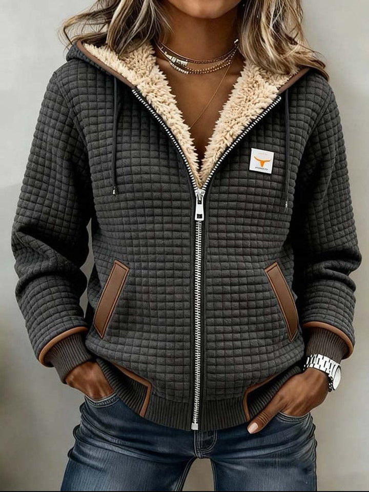Sancha | Sherpa-fôret quiltet zip-up hettejakke